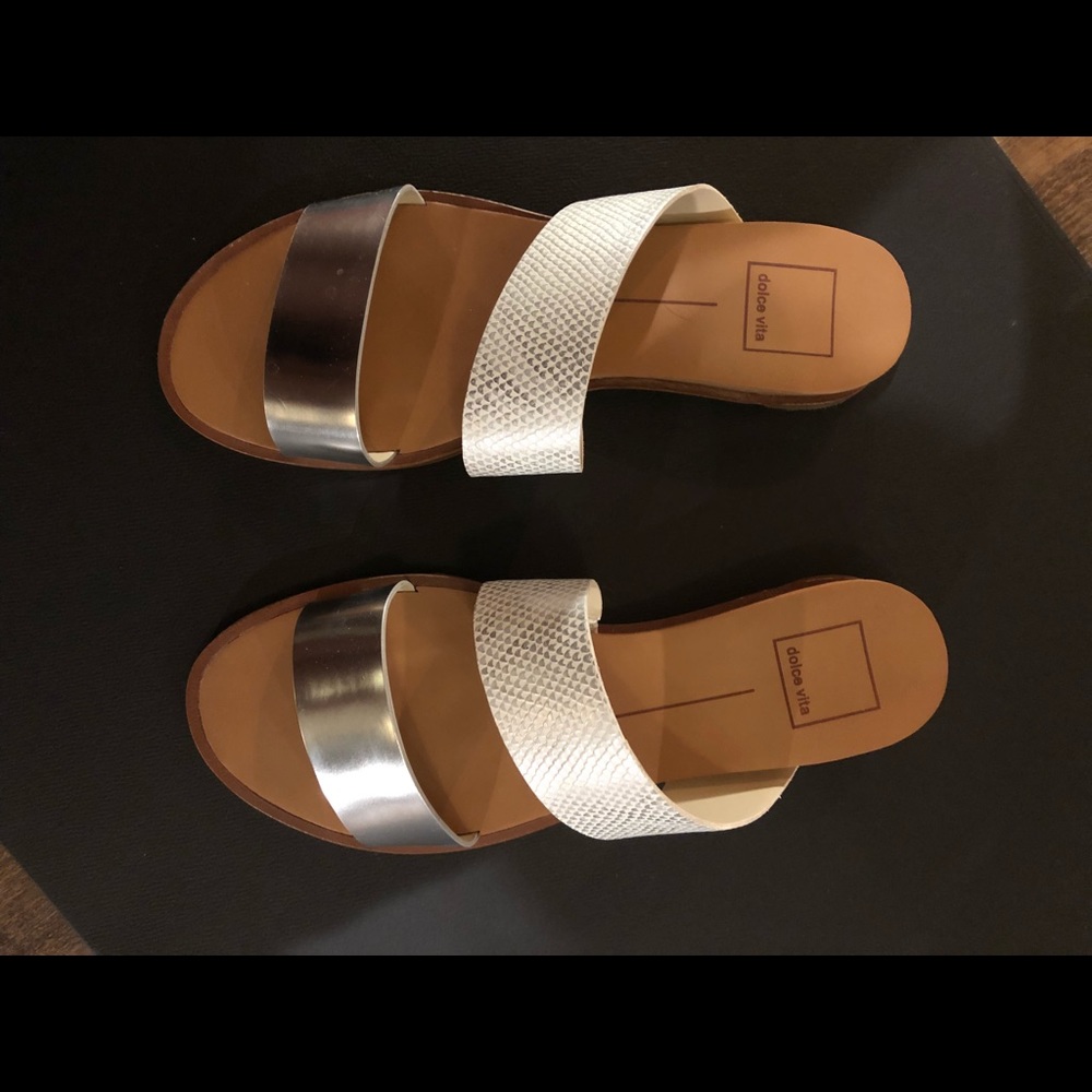 White and silver Dolce Vita sandals.